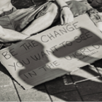 'Be the change you want to see in the world' sign at Gandhi Peace Festival